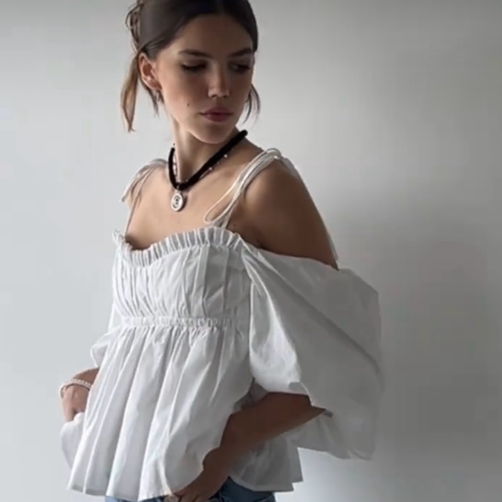 White Smocked Peplum Blouse with Ruffled Details